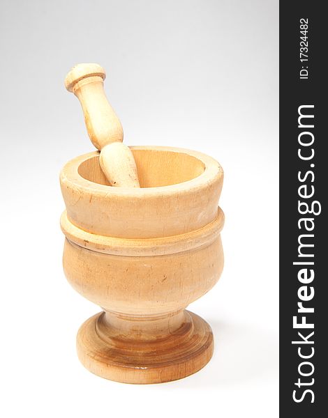 Wooden vintage mortar isolated with pestel