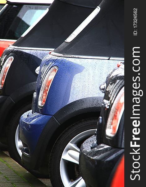 Polished car with water driping on a hot but wet day. Polished car with water driping on a hot but wet day