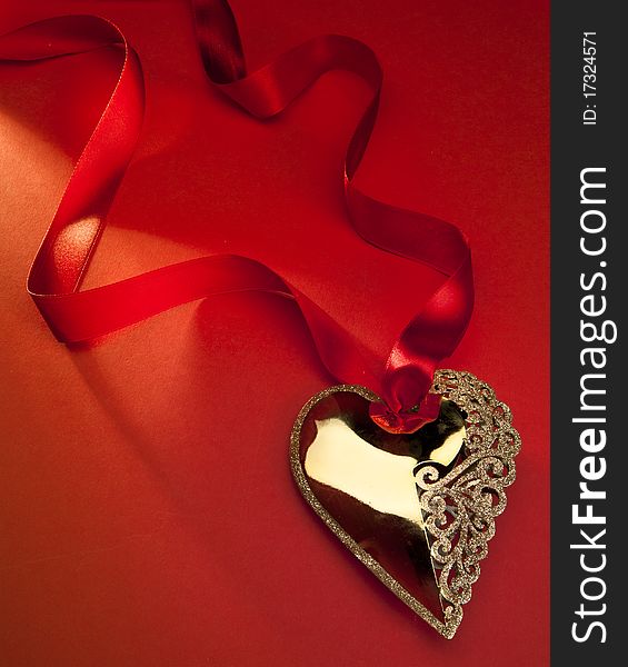 Christmas decoration Golden Heart with red ribbon. Christmas decoration Golden Heart with red ribbon