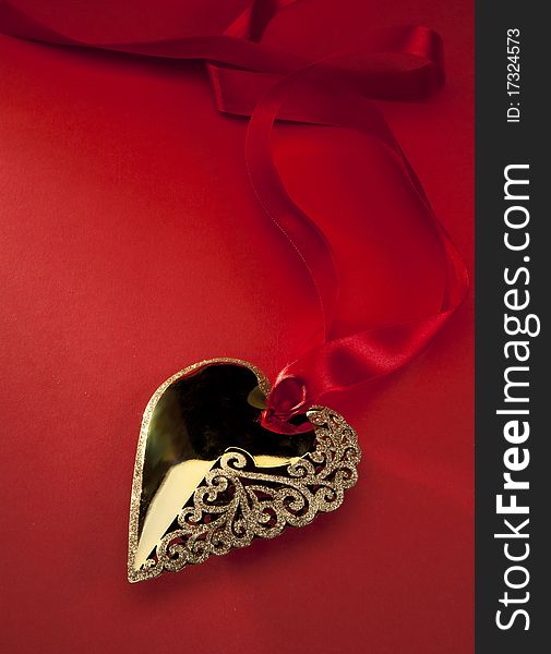 Christmas decoration Golden Heart with red ribbon. Christmas decoration Golden Heart with red ribbon