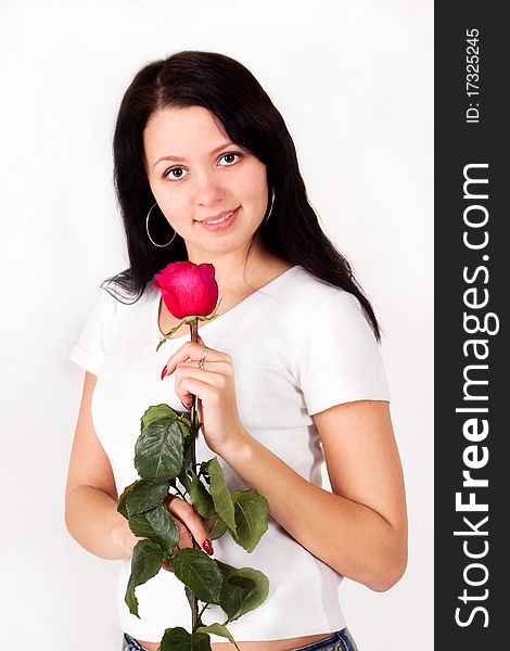 Pretty girl holding a rose, flower. Pretty girl holding a rose, flower