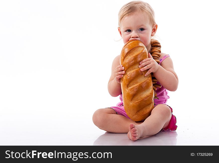 Baby biting a loaf of bread in roll beads