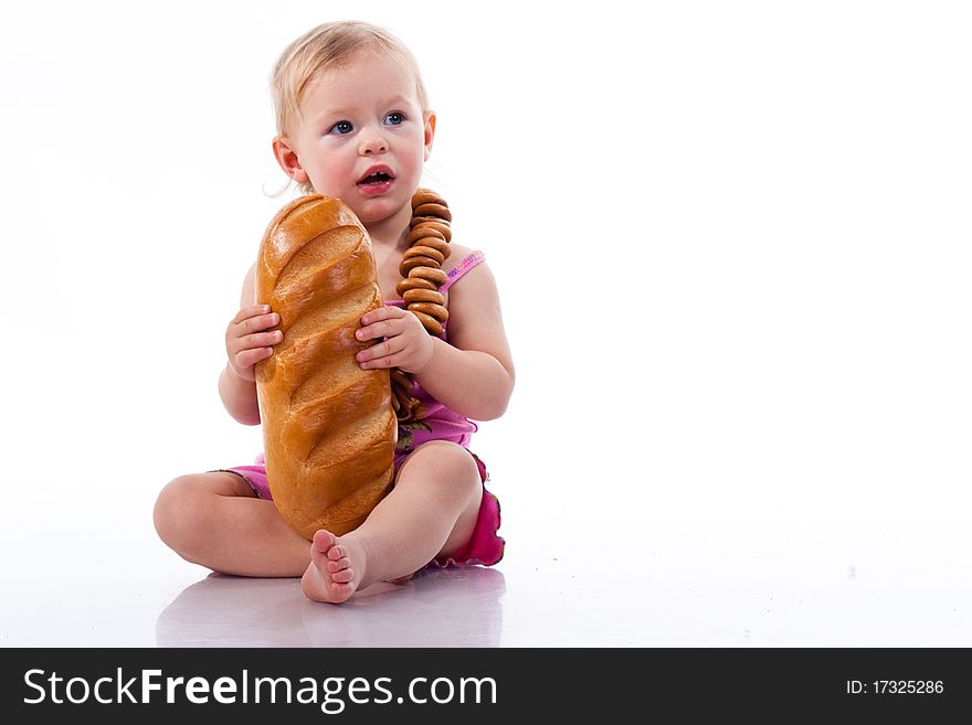 Baby Holding A Loaf Of Bread In Roll Beads