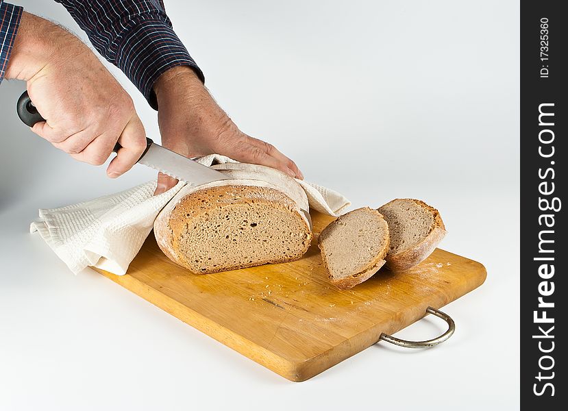 Cutting bwhite bread on chopping bjard. Cutting bwhite bread on chopping bjard