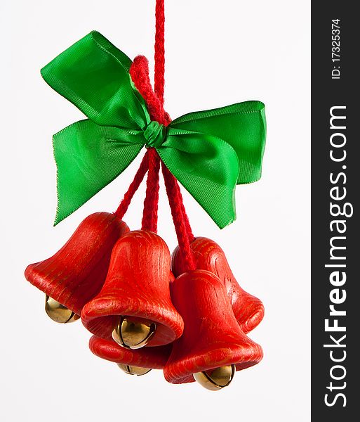 Red jingle bells with a green bow