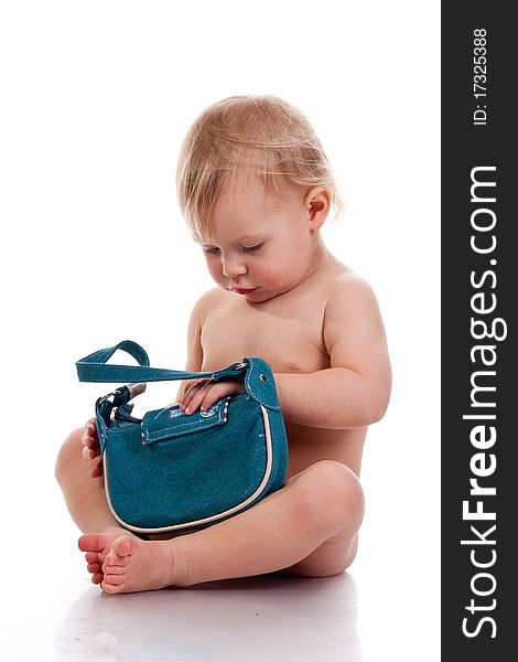 Baby looking into a small bag curious isolated on white