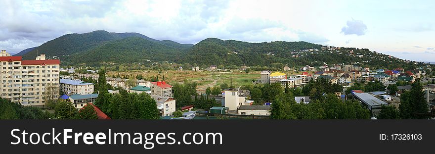 Small town at Mountains at a summer day. panoramic. Small town at Mountains at a summer day. panoramic