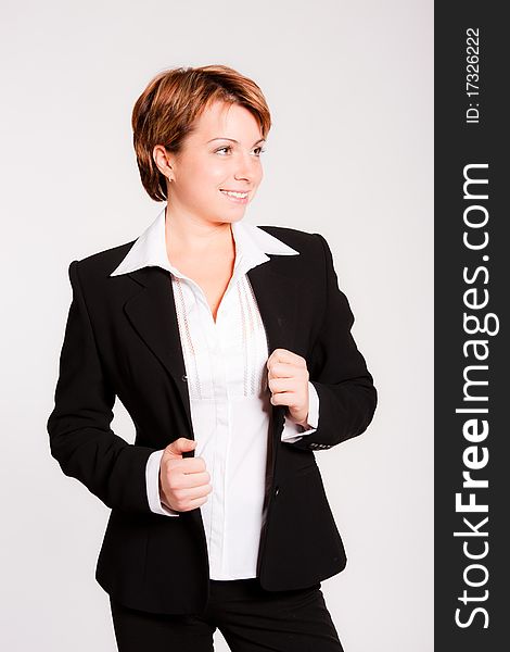Beautiful business woman standing on light grey background