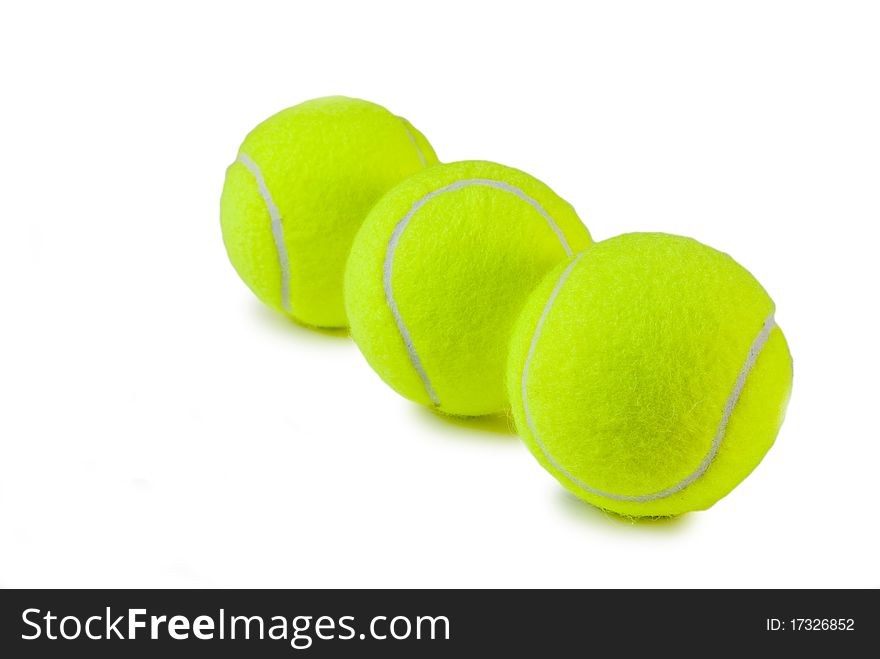 Three green tennis balls on a white background. Three green tennis balls on a white background