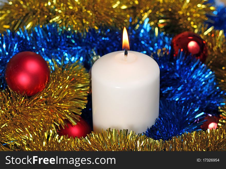 White candle in Christmas decorations