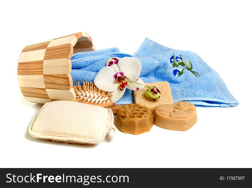 Soap and bath accessories on white background