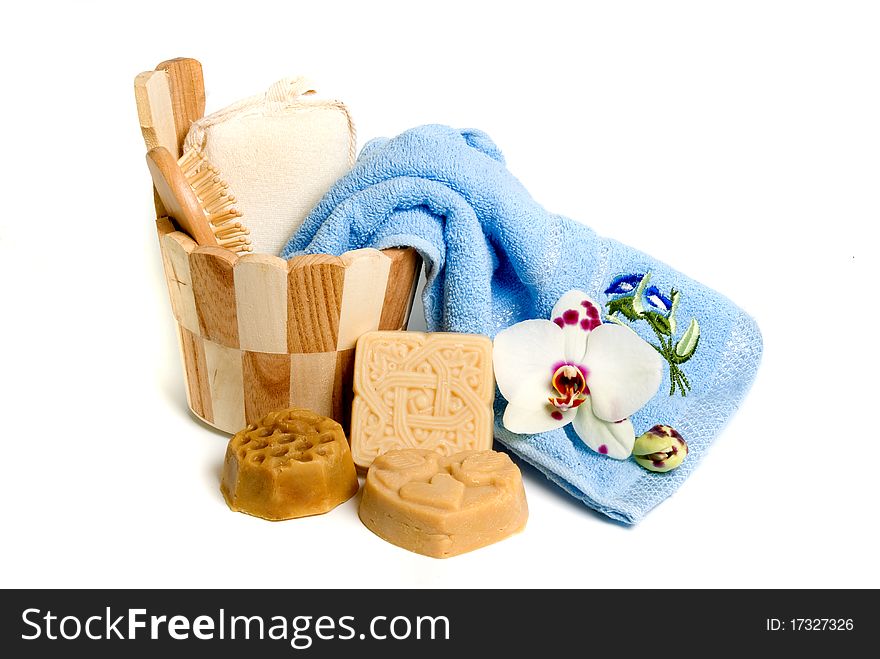 Soap and bath accessories on white background