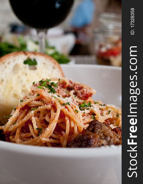 Spaghetti and meatballs with a salad