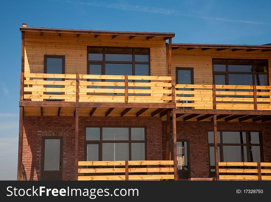Newly built two-storeyed wooden and brick town house. Newly built two-storeyed wooden and brick town house