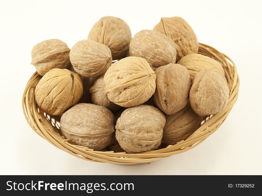Nuts basket isolated on white background