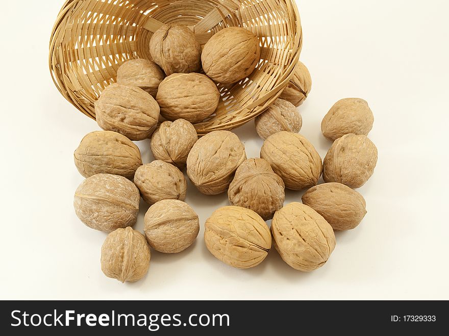 Wicker basket with nuts in the foreground