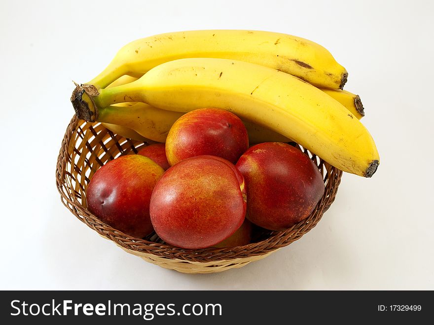 Basket with peaches and bananas. Basket with peaches and bananas