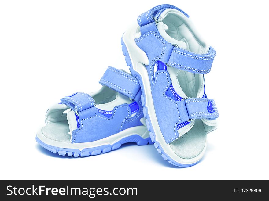 Blue child's sandals isolated on white