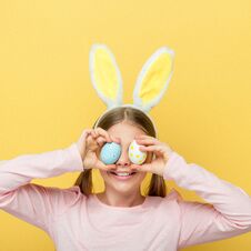 Cheerful Child With Bunny Ears Covering Royalty Free Stock Photos
