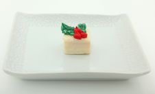 Single Petit Four On Plate Stock Photo