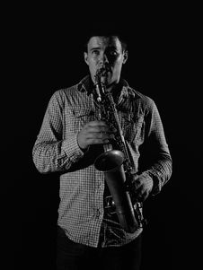 Young Handsome Man Playing Music On Saxophone Stock Photo Young Handsome Man Playing Music On Saxophone Stock Photo