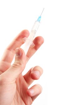 Hand Hold A Syringe. Isolated Stock Photography