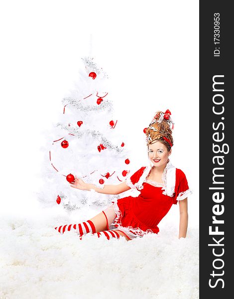 Beautiful young woman in Santa Claus clothes isolated over white background. Christmas. Beautiful young woman in Santa Claus clothes isolated over white background. Christmas.