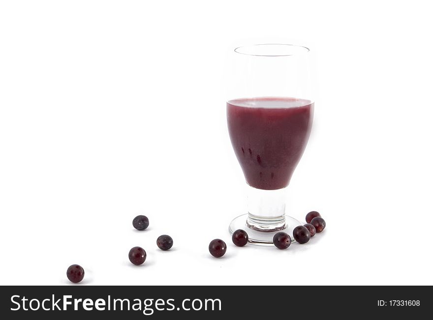 Glass of grape juices and grapes isolated on white background