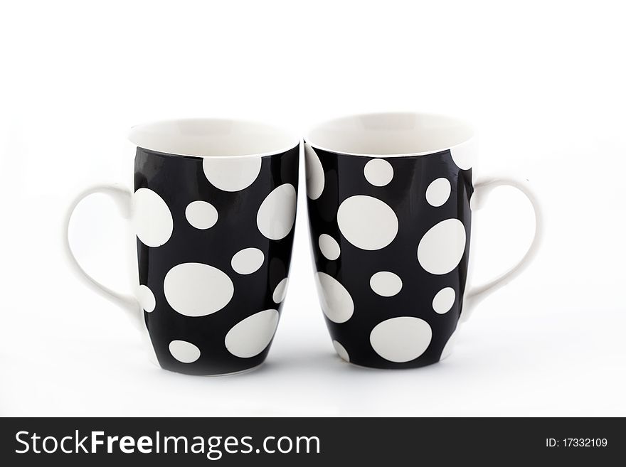 Two polka dot cups isolated on white. Two polka dot cups isolated on white