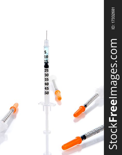 Medical syringes with human insulin ready for injection isolated on a white background