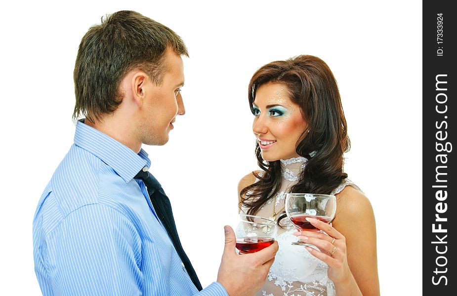 Happy young couple with wine glasses on white. Happy young couple with wine glasses on white