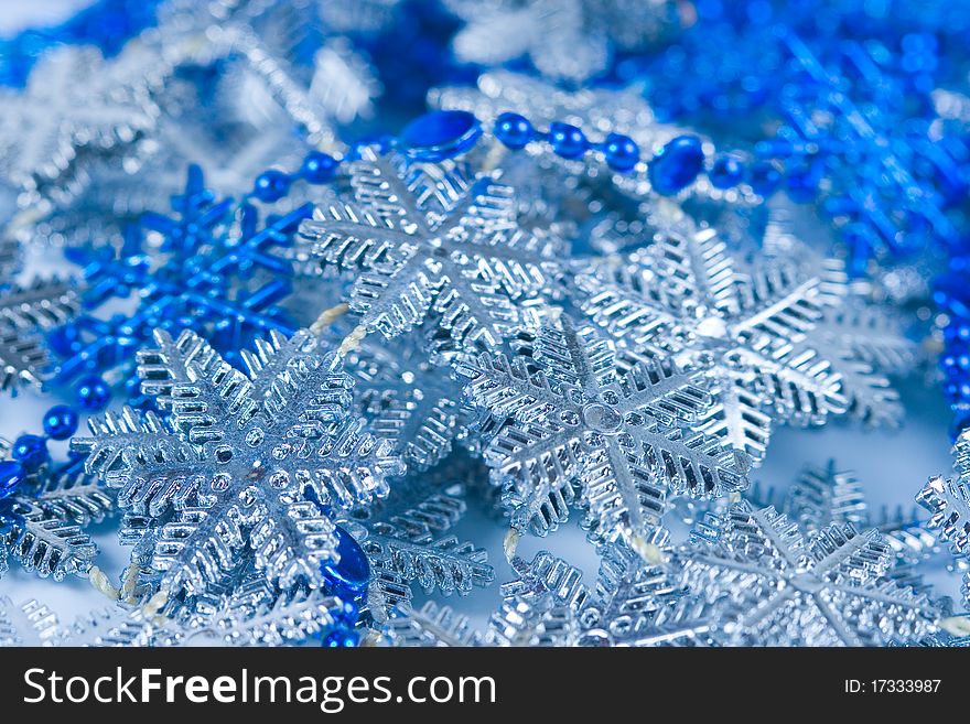 Christmas ornaments with silver and blue snowflake, beads