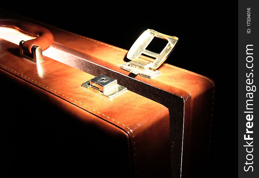 Leakage of diplomatic secrets via business suitcase; light coming out from suitcase