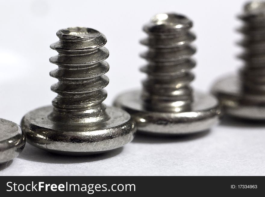 Macro of shiny screws for computer (shallow depth of field). Macro of shiny screws for computer (shallow depth of field)