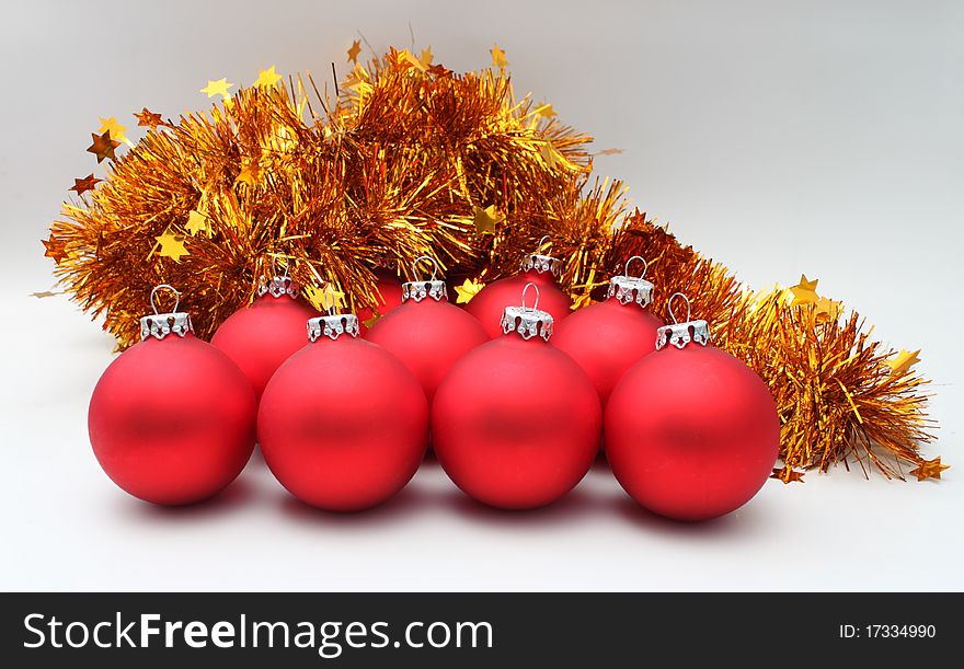 Christmas balls red matte, gold tinsel. Christmas balls red matte, gold tinsel
