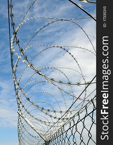 Barbed wire against a blue sky