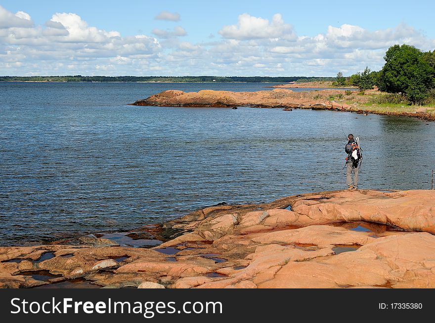 A fisherman angling on the sea