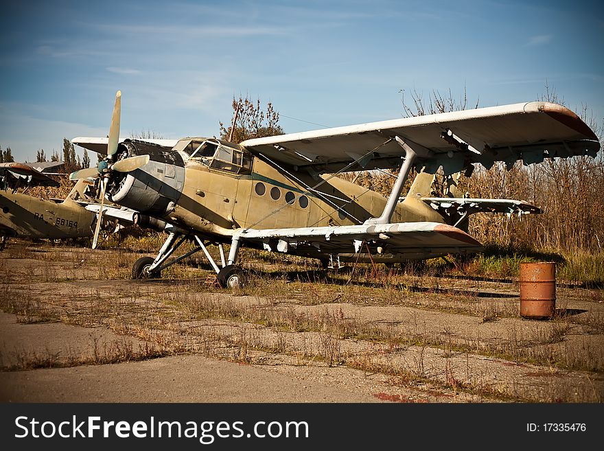 Discarded at the dump plane in an old airfield and barrel