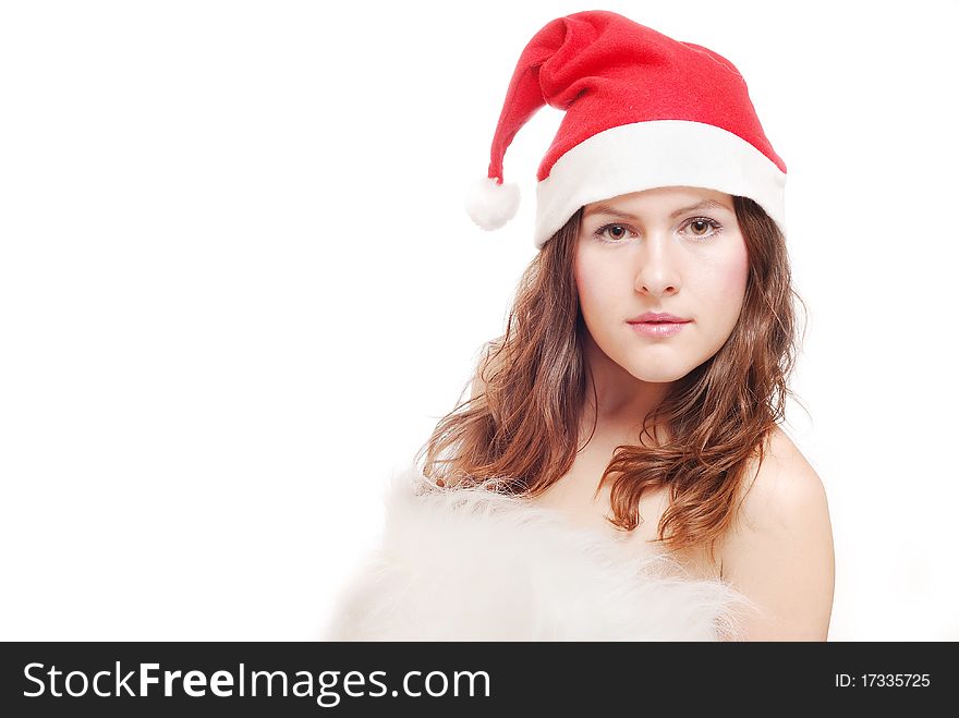 Portrait of a beautiful girl with a christmas hat isolated against a white background