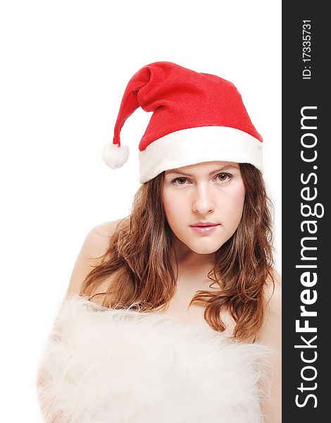 Portrait of a beautiful girl with a christmas hat isolated against a white background