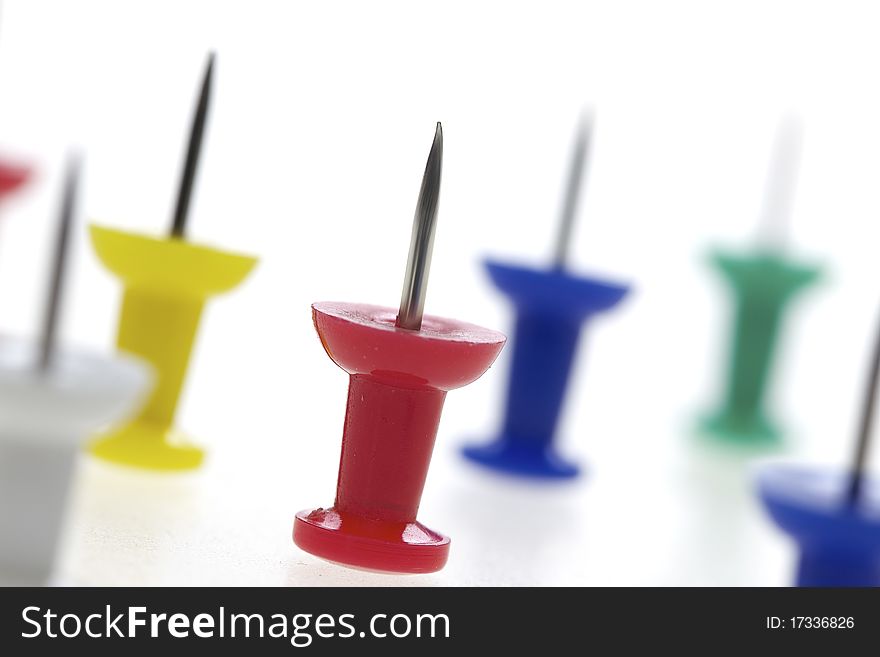 Multicolored Pushpins Isolated On A White