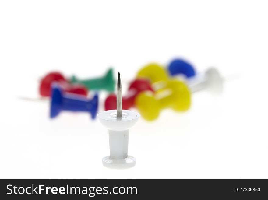 Multicolored Pushpins Isolated On A White
