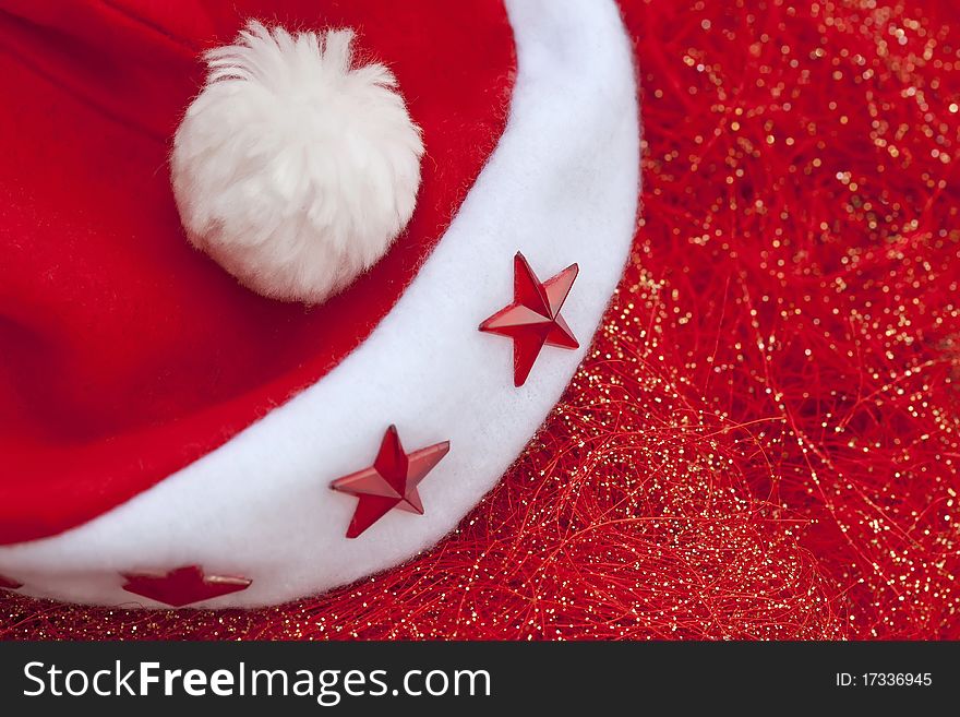 Santa claus cap on red glossy background. Santa claus cap on red glossy background