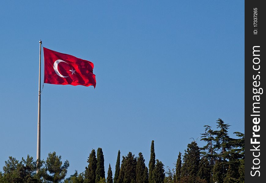 The Turkish flag flutters in the wind.