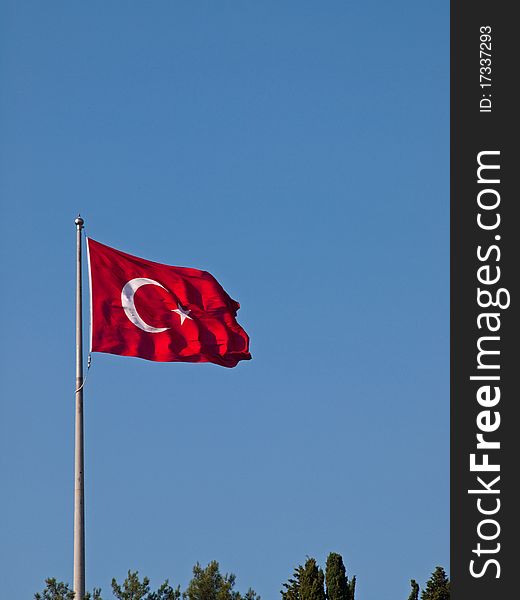 The Turkish flag flutters in the wind.