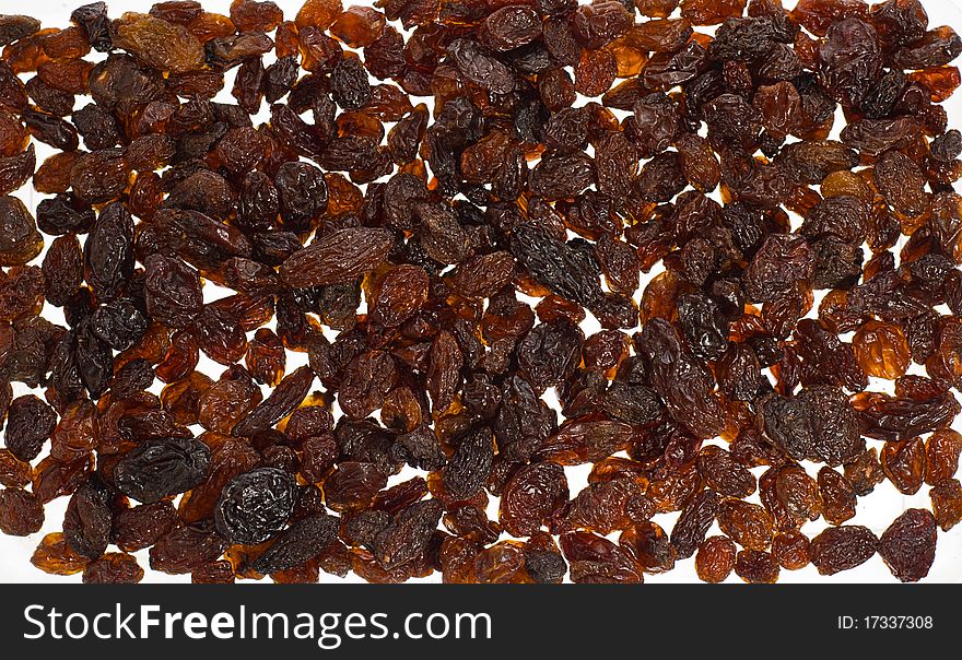 Versy-color brown raisins background/ texture