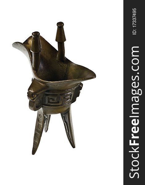 Jue - Chinese bronze ritual tripod wine vessel on white. Jue - Chinese bronze ritual tripod wine vessel on white.