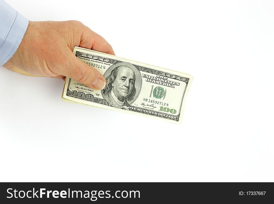 Dollars in a hand of the businessman on a white background