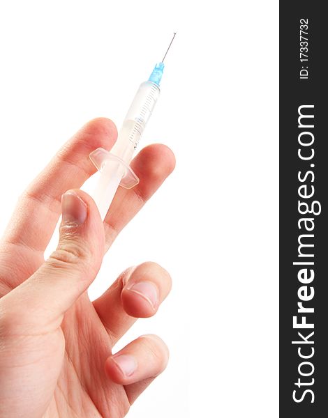 Hand Hold A Syringe. Isolated