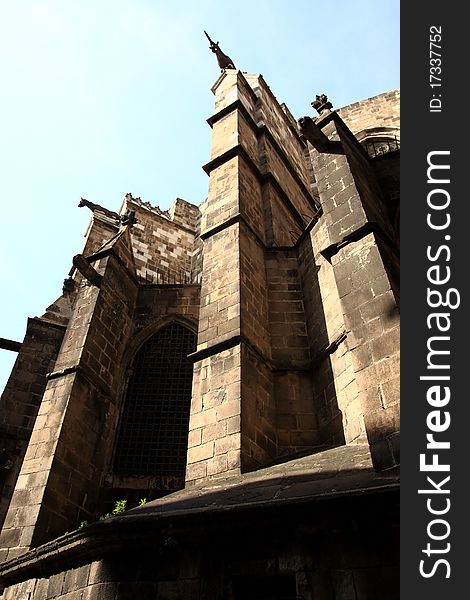 Fragment of a facade of a Gothic cathedral On Barcelonian street, Catalonia, Spain. Fragment of a facade of a Gothic cathedral On Barcelonian street, Catalonia, Spain.